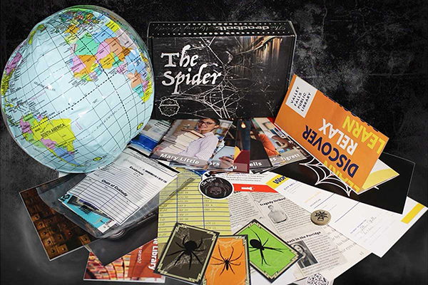 The Spider Board Game showing an inflatable globe, cards, and game accessories